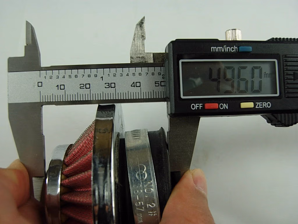 44mm Air Filter being measured with digital calipers, reading 49.60mm.