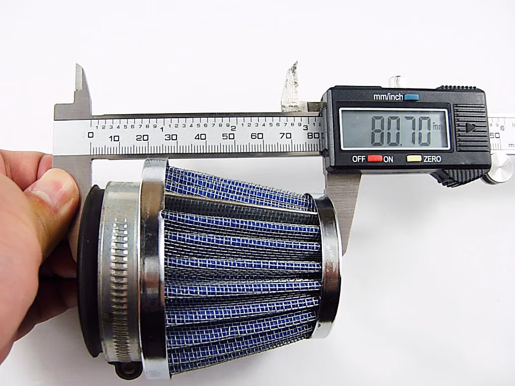 42mm Air Filter: Calipers measuring the air filter's diameter, showcasing its size and dimensions